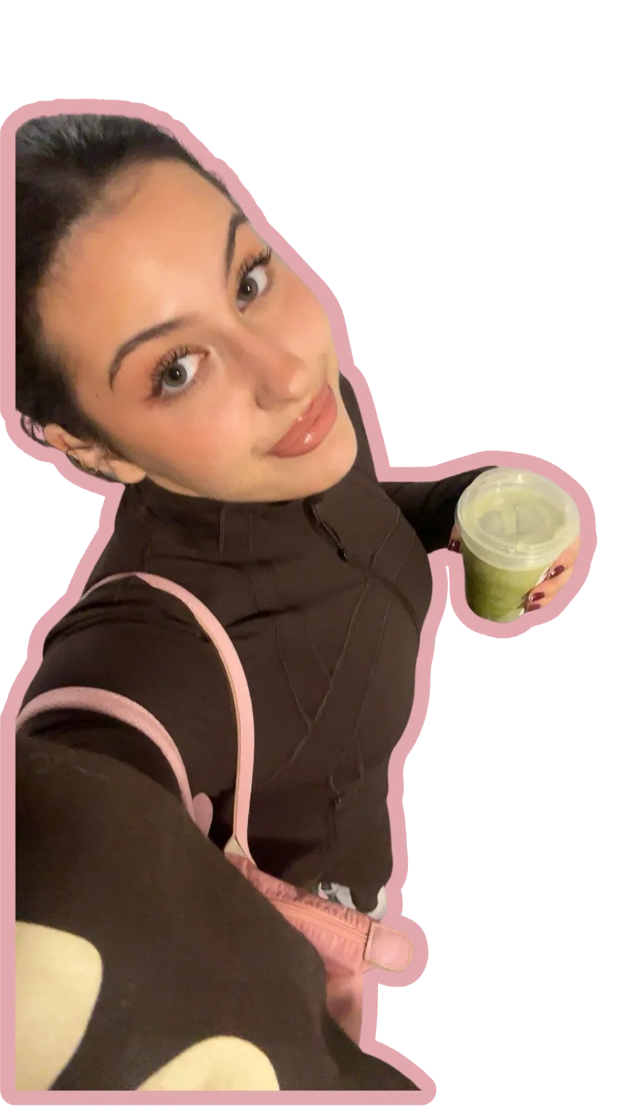 Angelina holding an iced matcha